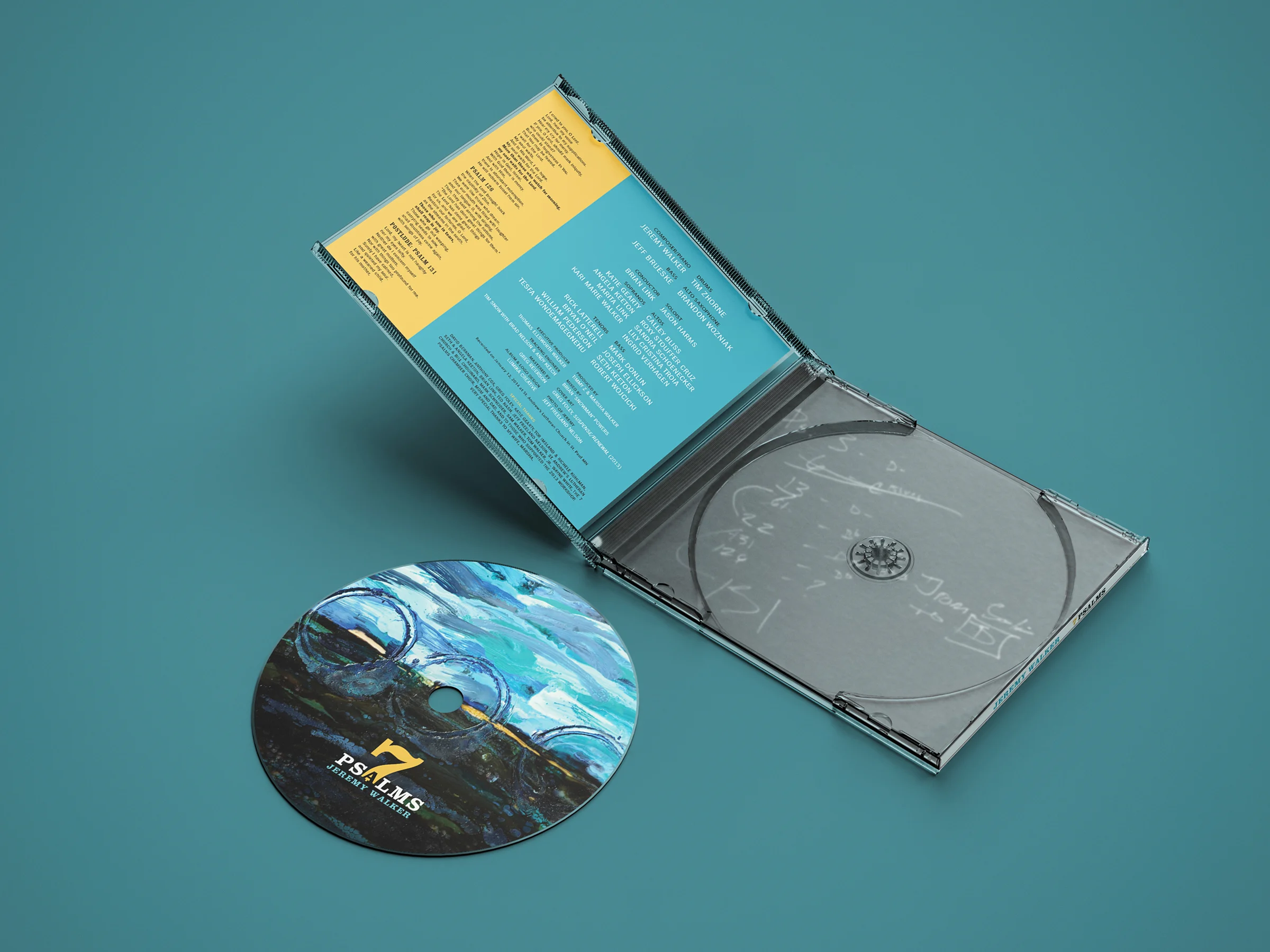 7 Psalms CD jewel case open with disc on a teal background