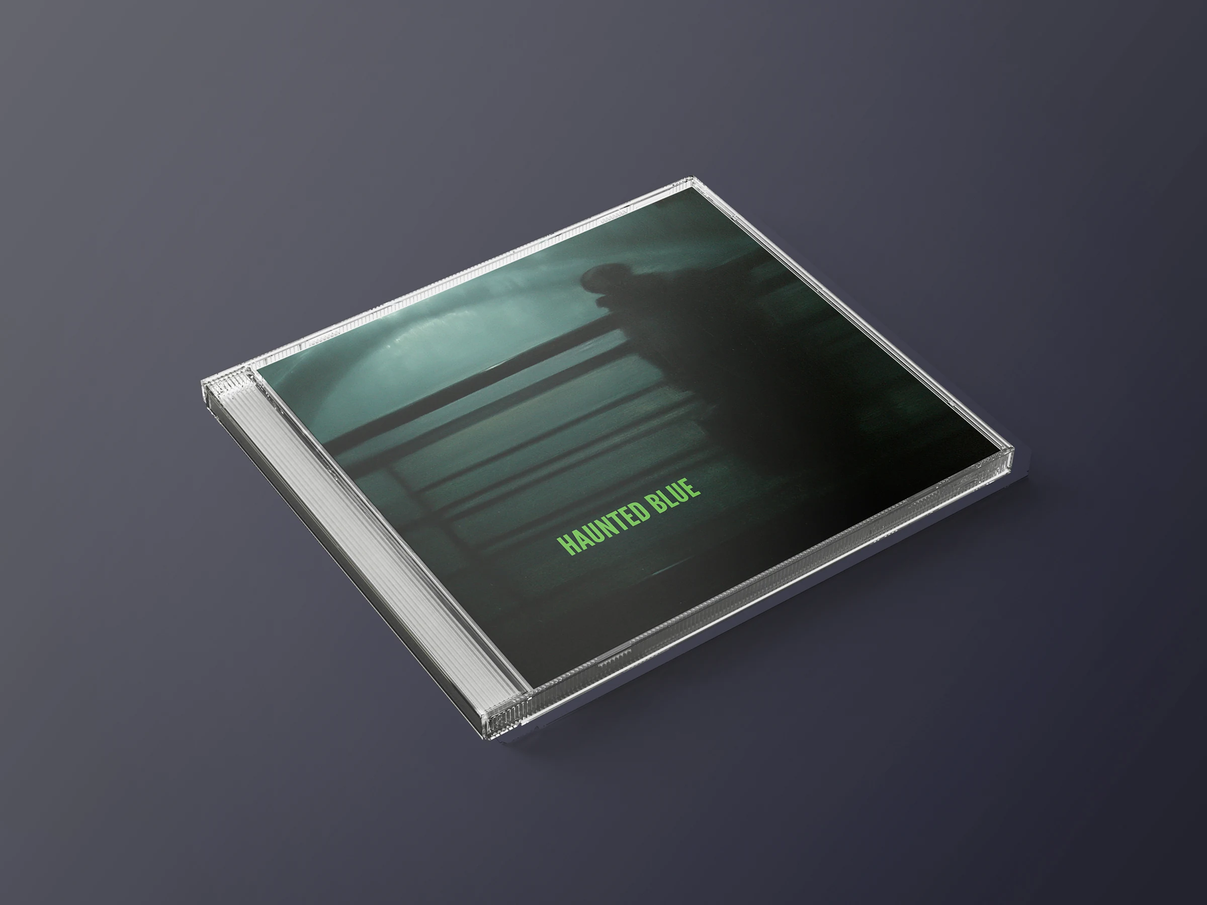 Haunted Blue CD jewel case on a dark background