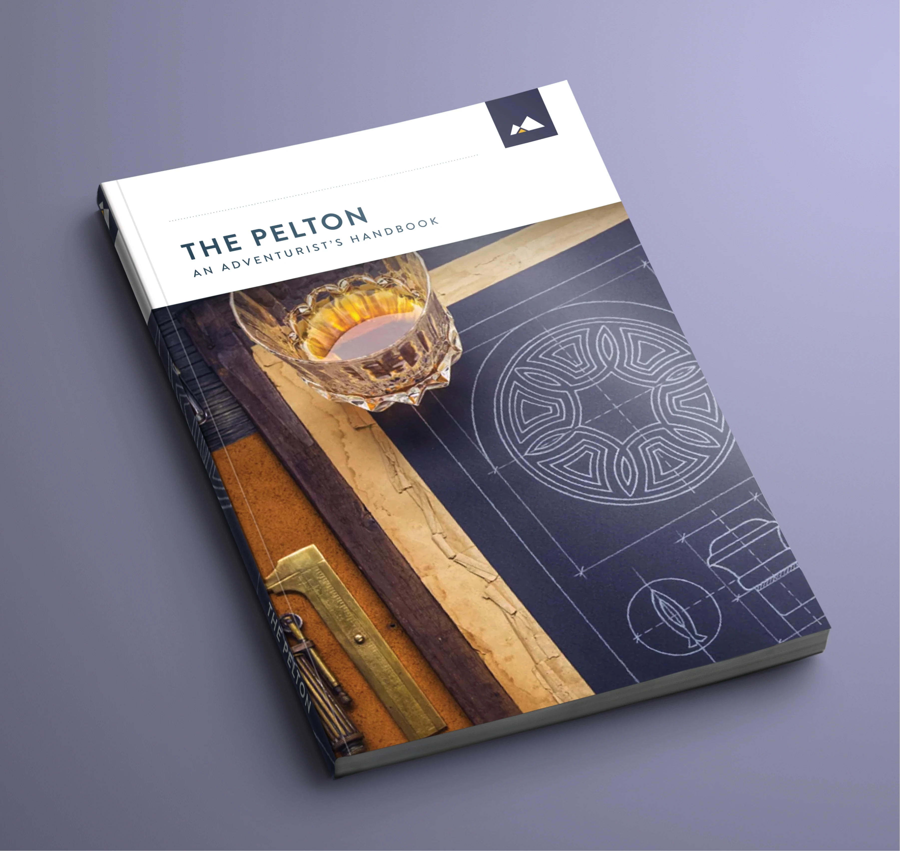 The Pelton adventurer's handbook journal cover with compass illustration