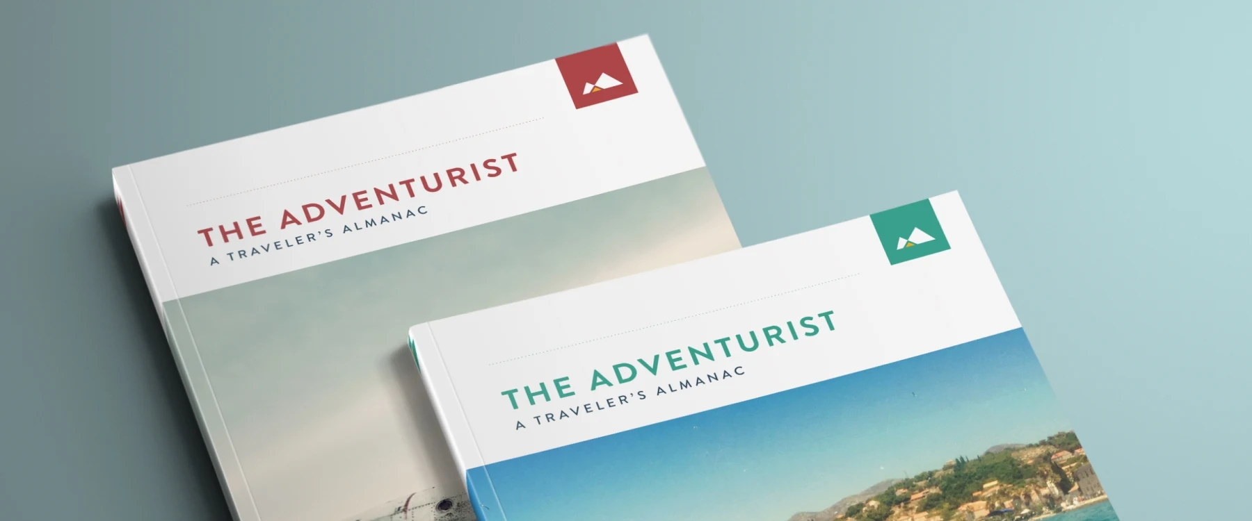 The Adventurist travel journals displayed on a light blue background